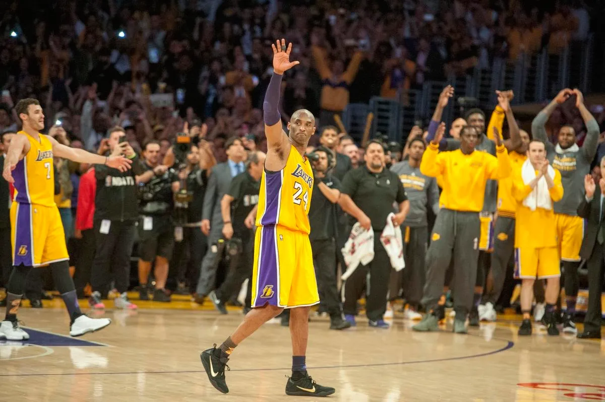 Kobe Bryant waves to the crowd in his final NBA game while wearing the Nike Kobe 11 Elite “Fade To Black” in Los Angeles on April 13, 2016.
